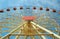 Big Vibrant Ferris Wheel in front of a Perfect Blue Sky. Happy Summer Activity