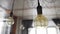 Big vintage incandescent light bulbs hanging in modern kitchen. Decorative antique edison light bulbs with straight wire