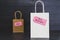 Big vs small budget shopping bags with text on price tags