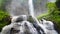 Big Waterfall Cascade with Water Splashing Creating Cataractagenitus Cloud Around Rainforest