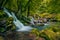 A big waterfall in deep forest in Nera Gorges Romania