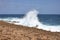 Big wave hits the sharp rocky coast of Aruba