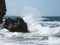 Big wave splashing black stones stormy sea nature scenic background