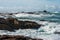 Big waves broken near stone seashore of France