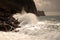 Big waves crushing on curved stone, on stormy weather, big tide. Alanya, Turkey.