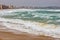 Big waves splashing on the beach in a spanish coastal, near the town Palamos in Costa Brava