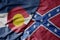 big waving colorful confederate jack flag and flag of colorado state