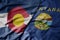 big waving colorful national flag of montana state and flag of colorado state