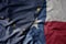 big waving colorful national flag of texas state and flag of alaska state