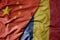 big waving national colorful flag of china and national flag of romania