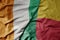 big waving national colorful flag of cote divoire and national flag of benin