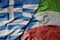 big waving national colorful flag of greece and national flag of equatorial guinea