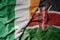big waving national colorful flag of ireland and national flag of kenya