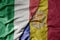 big waving national colorful flag of italy and national flag of andorra