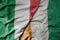 big waving national colorful flag of italy and national flag of cote divoire
