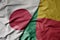 big waving national colorful flag of japan and national flag of benin