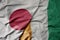 big waving national colorful flag of japan and national flag of cote divoire