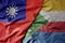 big waving national colorful flag of taiwan and national flag of comoros