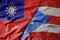 big waving national colorful flag of taiwan and national flag of puerto rico