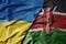 big waving national colorful flag of ukraine and national flag of kenya