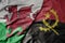 big waving national colorful flag of wales and national flag of angola