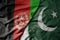 big waving realistic national colorful flag of afghanistan and national flag of pakistan