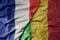 big waving realistic national colorful flag of france and national flag of mali
