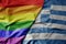 big waving realistic national colorful flag of greece and rainbow gay pride flag