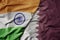 big waving realistic national colorful flag of india and national flag of qatar