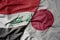big waving realistic national colorful flag of iraq and national flag of japan