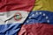 big waving realistic national colorful flag of paraguay and national flag of venezuela