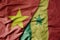 big waving realistic national colorful flag of vietnam and national flag of senegal