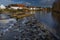 Big weir on Vltava river in Roznov part of Budweis city in winter spring evening
