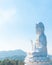 Big white bodhisattva guanyin statue with blue sky background at Wat Huai Pla Kung temple, Chiang rai,Thailand.Asian Landscape