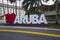 Big white capital letters I love Aruba along a road in the center of Oranjestad, the capital of Aruba.