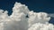 Big white fluffy clouds time lapse. White clouds and blue sky. UHD 4K
