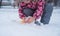 Big white snow comp. The child plays outdoors with snow in March. Snow in spring in Ukraine