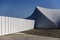 Big white tent pavilion for mass events on a background of blue sky