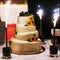 Big white weddin cake decorate sunflowers ladybird and firework