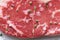 Big whole piece of raw beef meat, striploin. Steak with seasoning, close up, macro