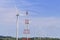 The big windmill turbine field and the electricity pylon