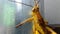 a big wooden grasshopper, crawling on the zinc door