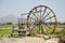 Big wooden turbine baler water wheel at Thai Dam Cultural Village