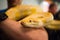 Big yellow burmese python held in human hands