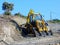 Big Yellow Digger Excavating New Dirt Road