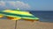 big yellow and green sunshade on the beach