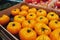 Big yellow heirloom tomatoes in the box at the market place.