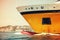 Big yellow passenger ferry ship goes on speed, toned