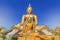 biggest golden buddha statue in wat muang public temple at angthong province, thailand