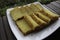 Bika Ambon, Indonesian cake with square slices in white plate. Yellow cake from Medan, Indonesia